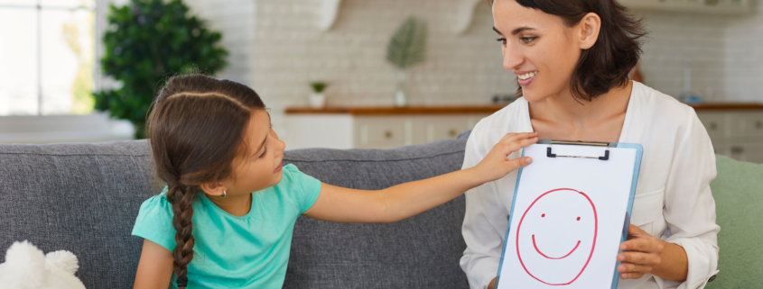 A child practicing their speech in therapy